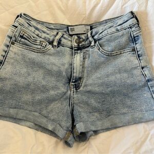 Light blue jean shorts.